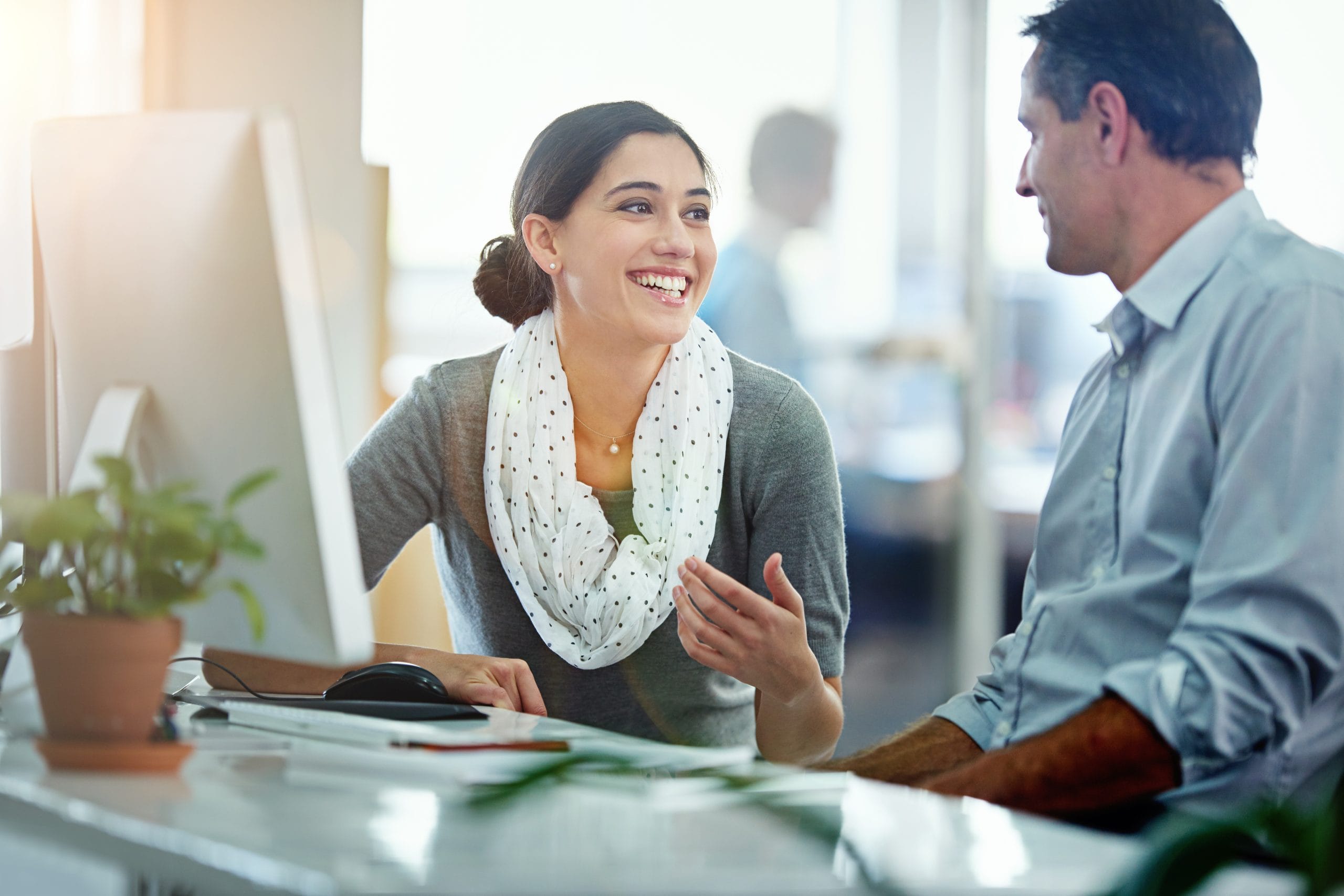 Two colleagues at a computer